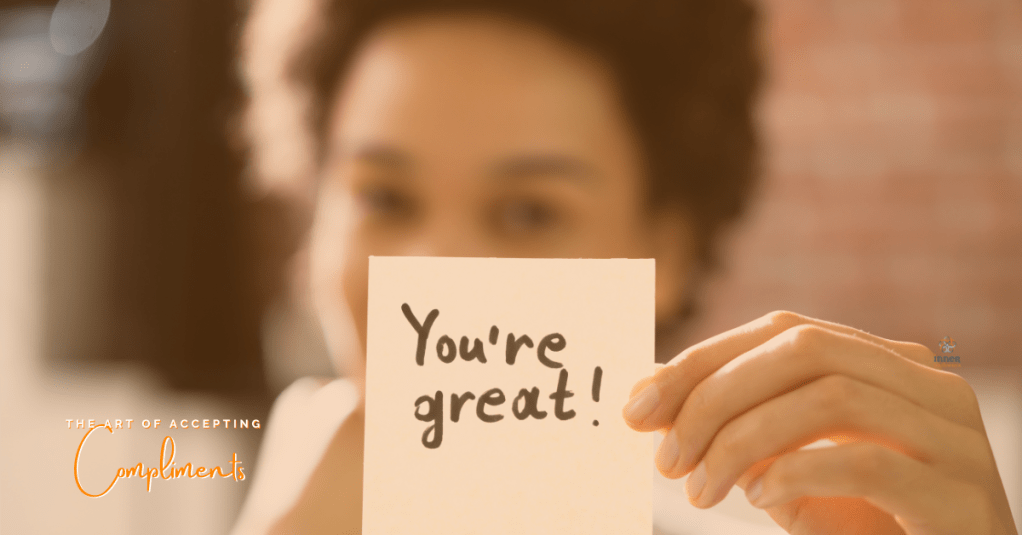 woman holding up a note that states 'you're great' with caption 'the art of accepting compliments'